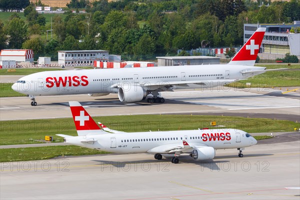 Boeing 777-300ER and Airbus A220-300 aircraft of Swiss at Zurich Airport