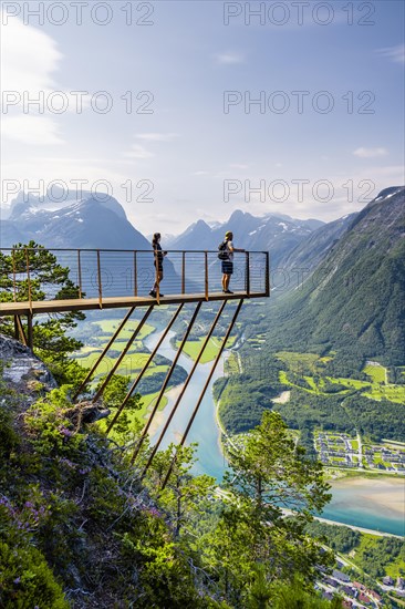 Hikers standing on viewing platform Rampestreken