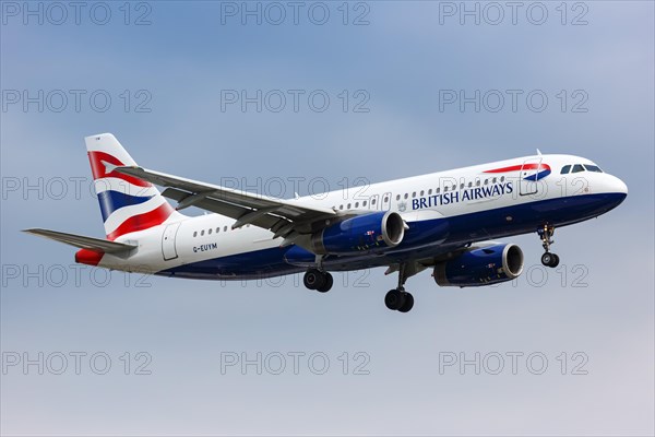 A British Airways Airbus A320 with registration G-EUYM lands at London Heathrow Airport