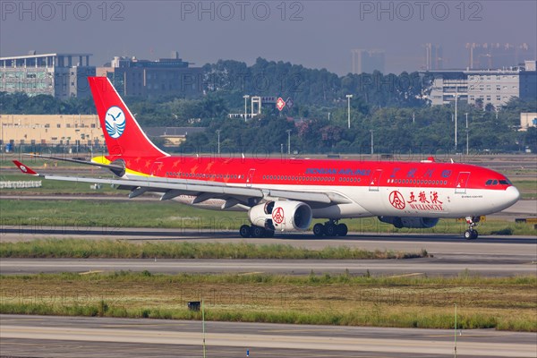 An Airbus A330-300 aircraft of Sichuan Airlines with registration number B-5923 and Wuliangye special livery at Guangzhou Airport