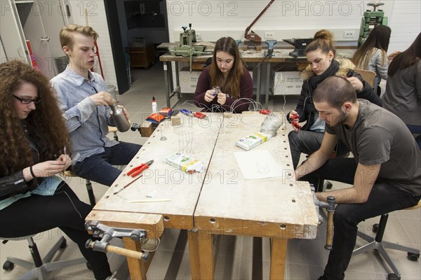 Students in the design class make a work of art with wire