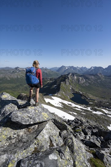 Hiker on the trail to the mountain Rundfjellet