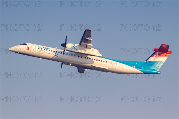 A Bombardier DHC-8-400 of Luxair with registration LX-LGN at Malpensa Airport in Milan