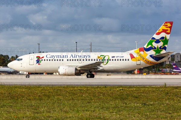 A Boeing 737-300 aircraft of Cayman Airways with the registration VP-CAY at Miami Airport