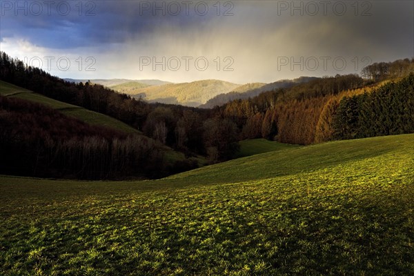 Dramatic weather in the evening in a low mountain landscape