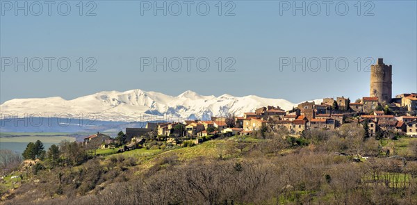 Village of Montpeyroux and view on Sancy massif in winter