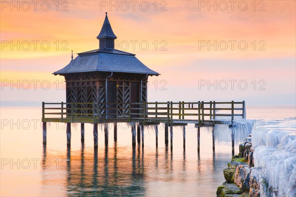 Iced bathhouse at sunrise