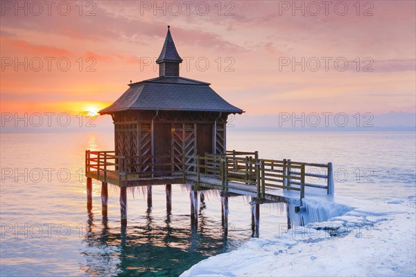 Iced bathhouse at sunrise