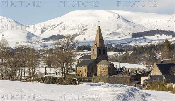 Massif of Sancy and Saint-victor la Riviere village in Regional natural park of the volcanoes of Auvergne in winter