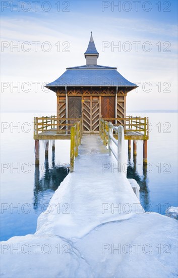 Iced bathhouse at dusk