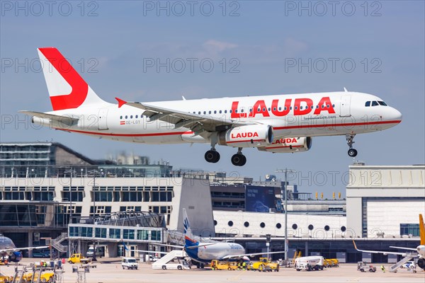 A Lauda Airbus A320 aircraft with registration number OE-LOY lands at Stuttgart Airport