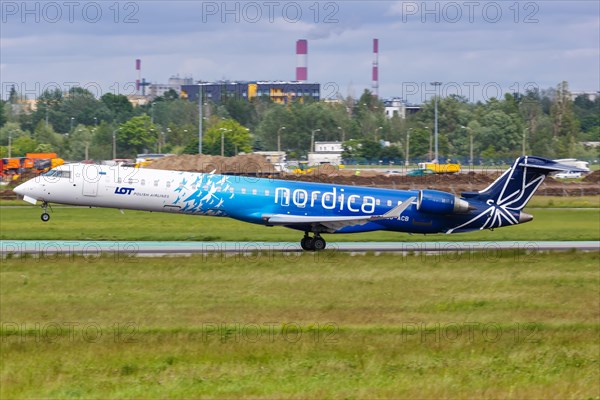 A Bombardier CRJ-900 aircraft of Nordica with registration number ES-ACB at Warsaw Airport