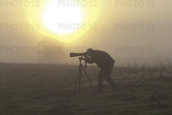 Nature photographer at sunrise