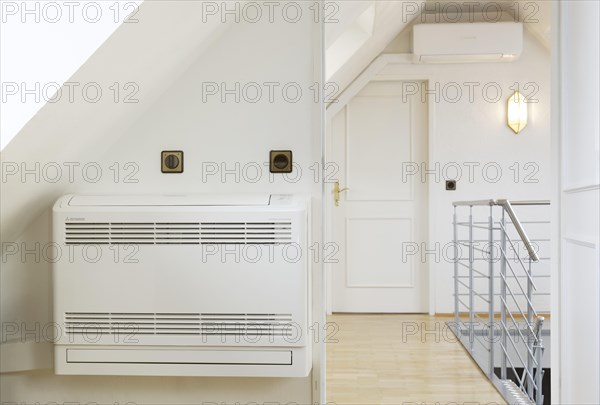 Split air-conditioning system in the attic conversion of an old building