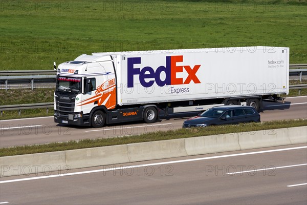 FedEx truck driving on the A8 motorway near Jettingen