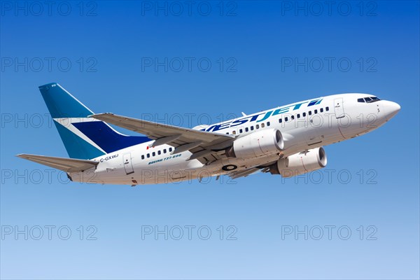 A Westjet Boeing 737-600 aircraft with registration C-GXWJ takes off from Phoenix Airport