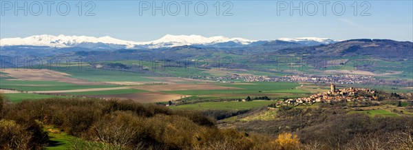 Village of Montpeyroux and view on Sancy massif in winter