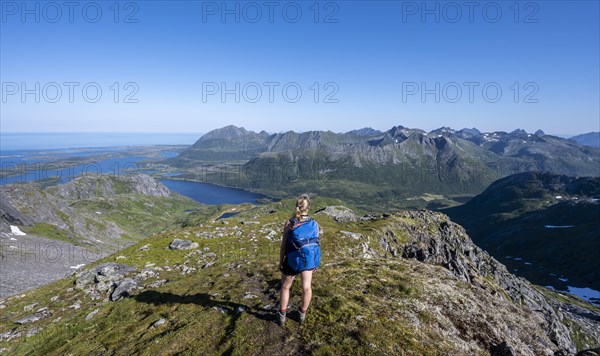 Hiker on the trail to the mountain Rundfjellet