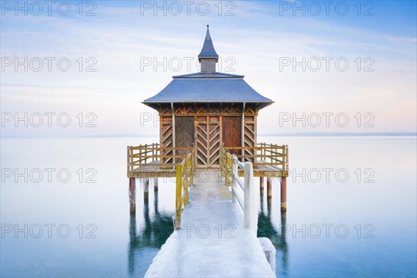 Iced bathhouse at dusk