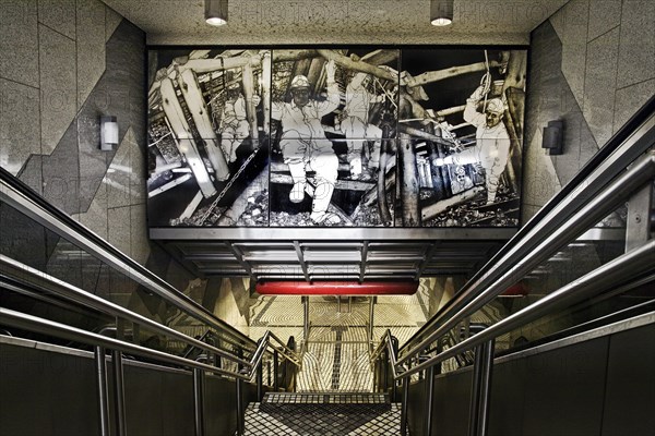 Entrance to the underground station Bergwerk Consolidation with artwork about mining by Alfred Schmidt