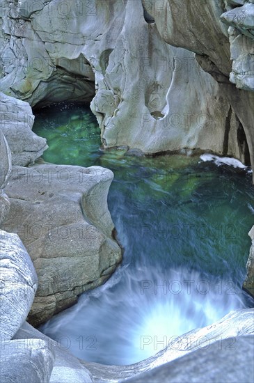 Rock formed by the turquoise Maggia stream