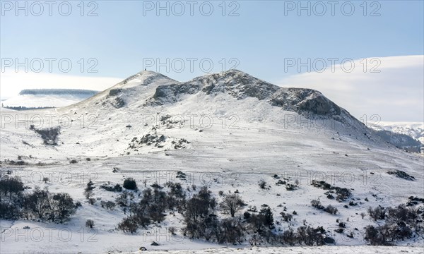 Mont Chabrut in winter on the Cezallier plateau in the Auvergne volcanoes regional natural park