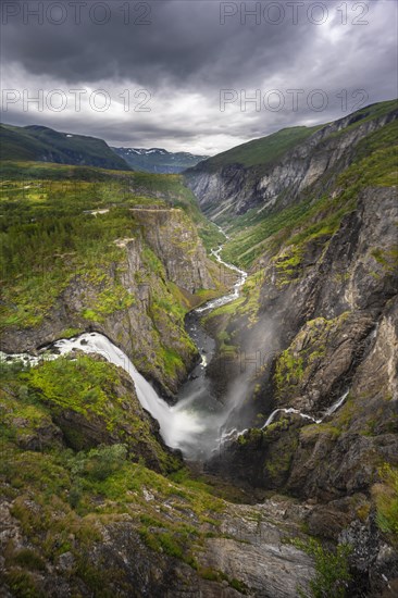 View into the river valley with waterfall Voringfossen