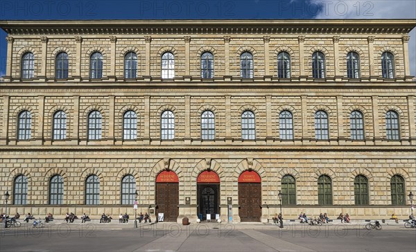 People sunbathing in front of the Residenz