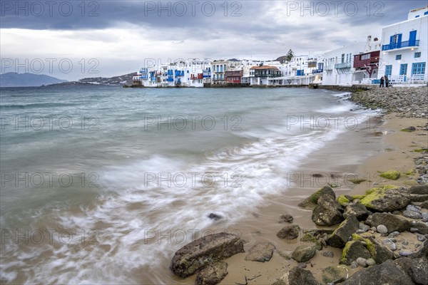 White Cycladic houses on the shore