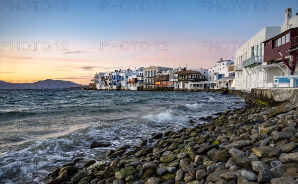 White Cycladic houses on the shore