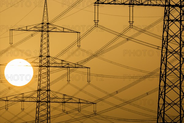 Power pylons at sunset