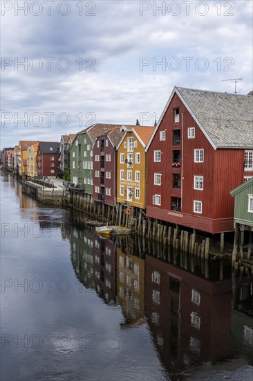 Colourful historic warehouses by the river Nidelva