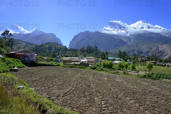 Village with view of Nevado Huandoy and Nevado Huascaran