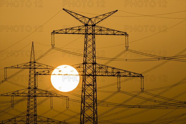 Power pylons at sunset