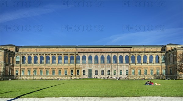 People sunbathing behind the south side of the Alte Pinakothek