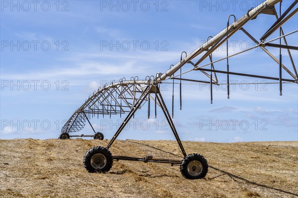 Moving irrigation system standing on a dry stubble field in Alentejo