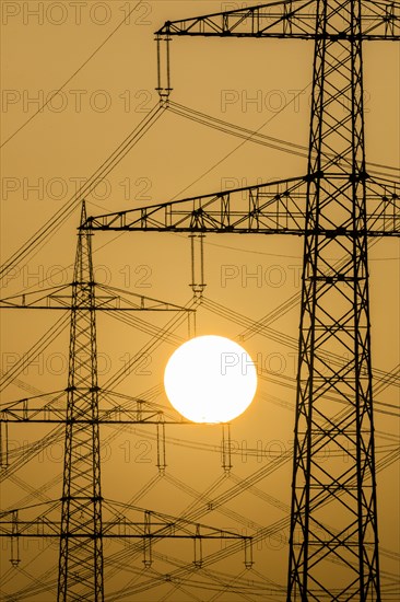 Power pylons at sunset