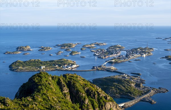 Houses on small rocky islands in the sea