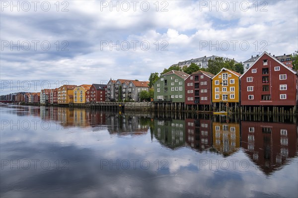 Colourful historic warehouses by the river Nidelva