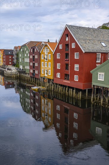 Colourful historic warehouses by the river Nidelva