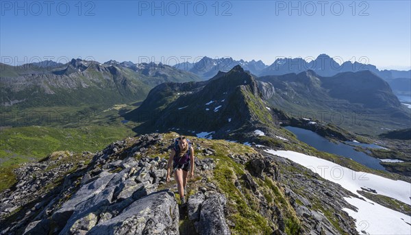 Hiker on the trail to the mountain Rundfjellet