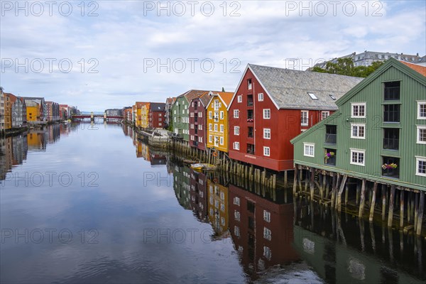 Colourful historic warehouses by the river Nidelva