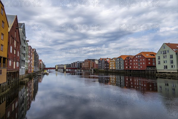 Colourful historic warehouses by the river Nidelva