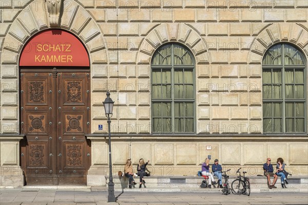 People sunbathing in front of the Residenz