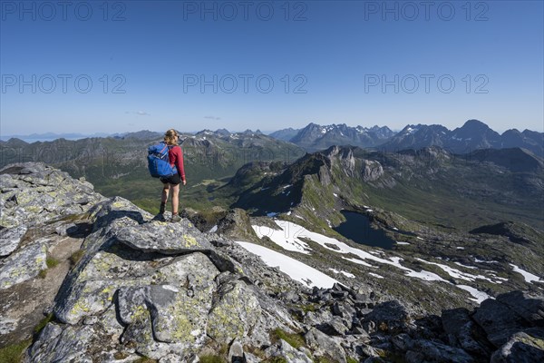 Hiker on the trail to the mountain Rundfjellet