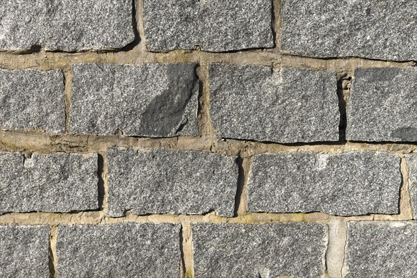 Wall of granite stones