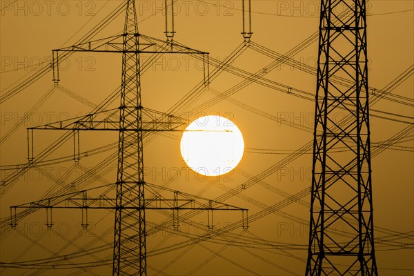 Power pylons at sunset