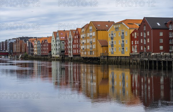 Colourful historic warehouses by the river Nidelva