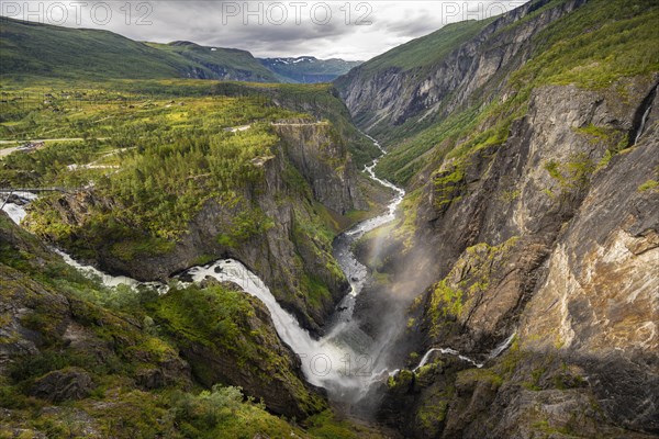 View into the river valley with waterfall Voringfossen