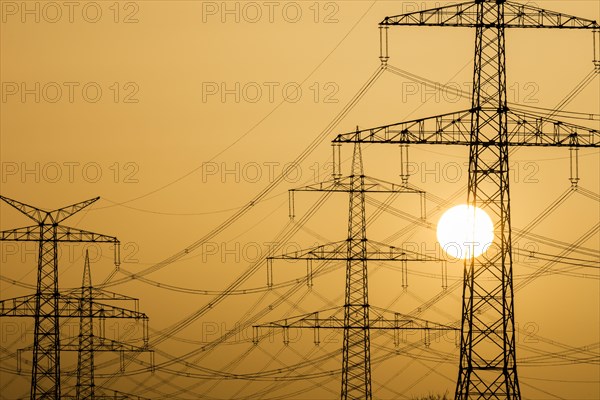 Power pylons at sunset